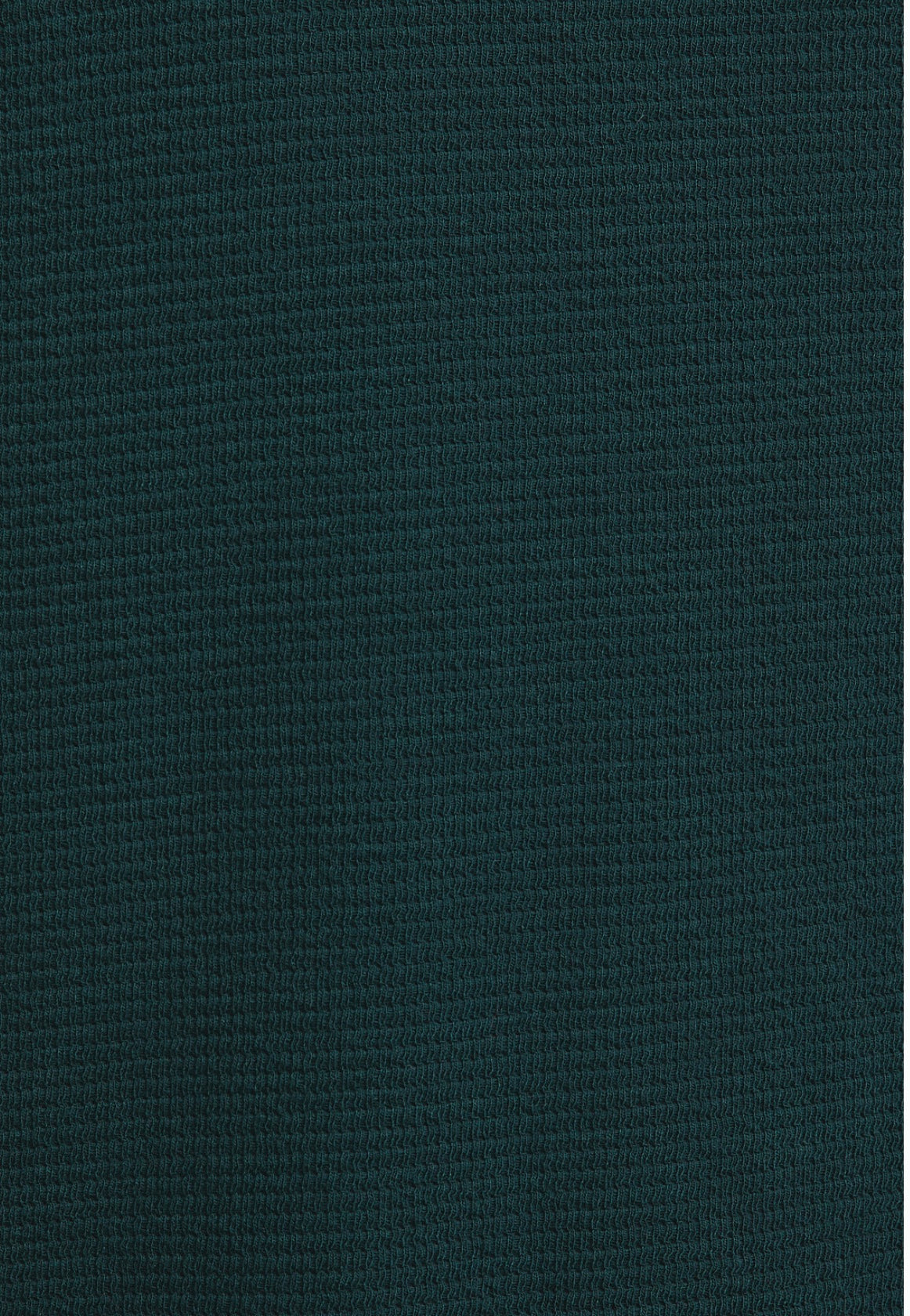 Dark green textured fabric close-up