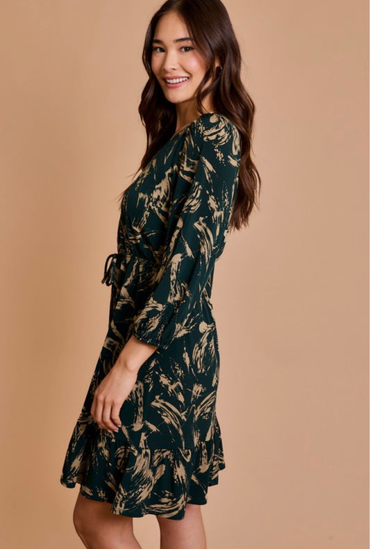 Woman wearing a patterned dress on a beige background