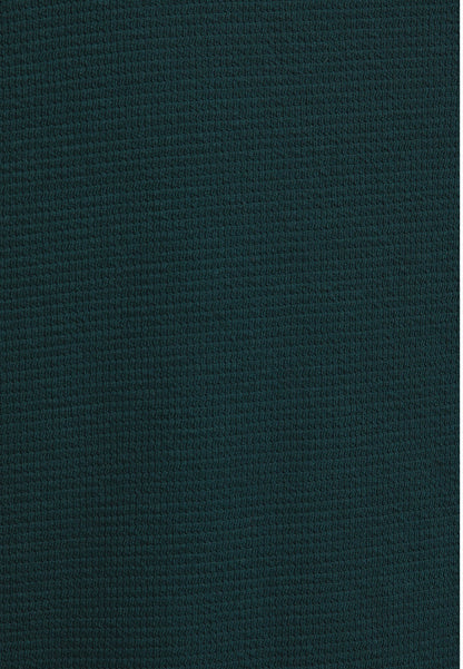 Dark green textured fabric close-up