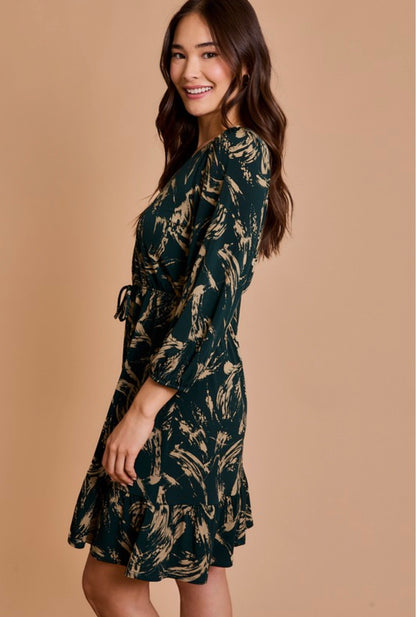 Woman wearing a patterned dress on a beige background
